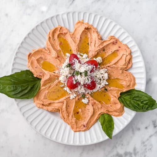 Flower Hummus Platter with feta tomatoes and herbs