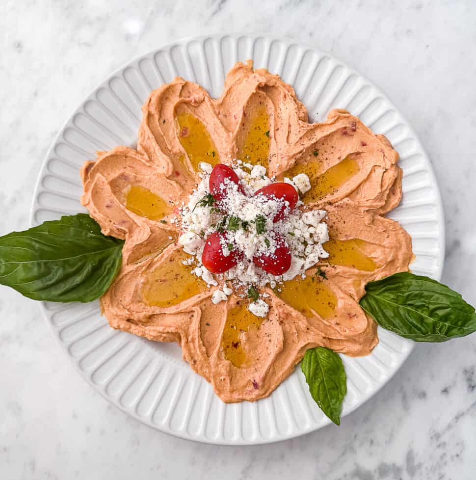 Flower Hummus Platter with feta tomatoes and herbs