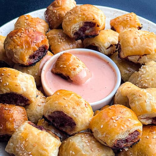 Burger puff pastry bites served on a platter, golden brown and flaky, perfect for smoking or baking