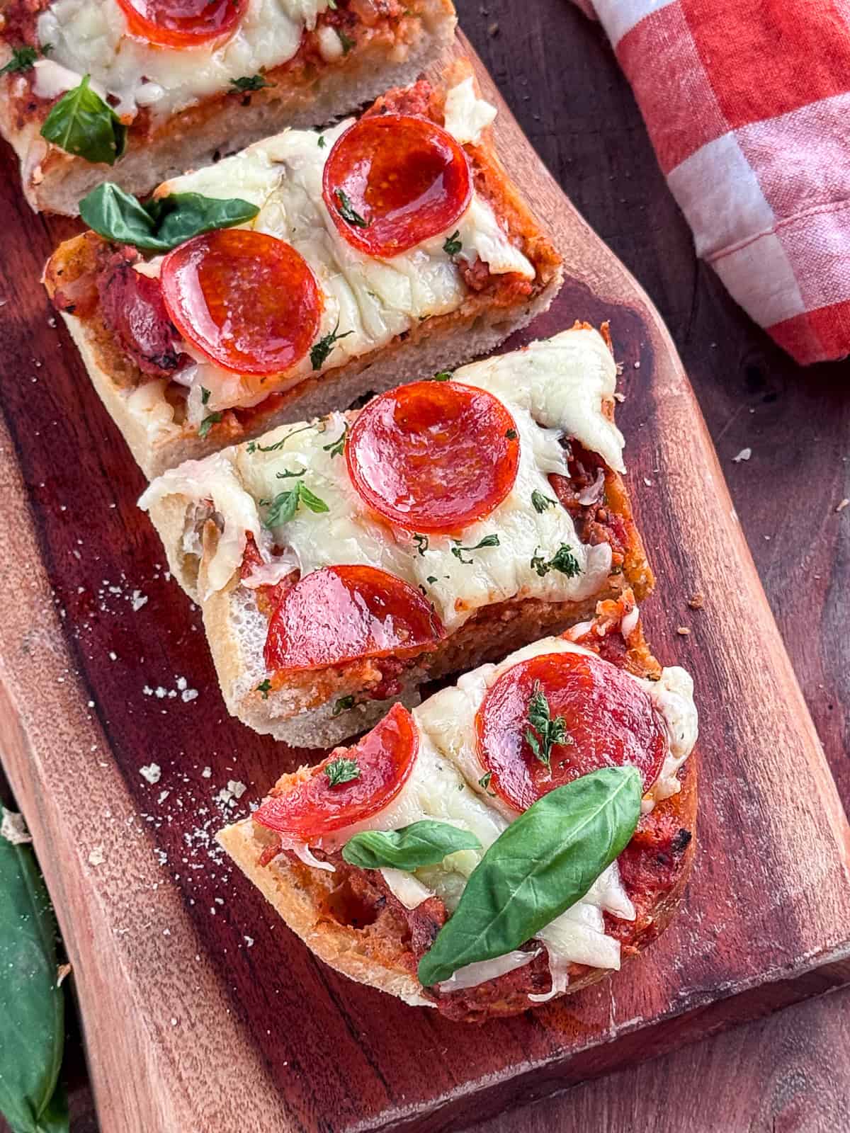 Closeup Slices of Grilled French Bread Pizza on Serving Tray