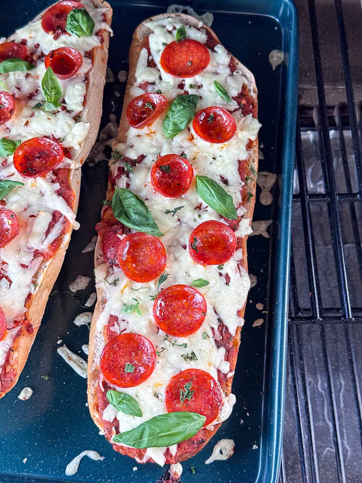 Top Down Shot of Italian Herbs and Toppings on Grilled French Bread Pizza