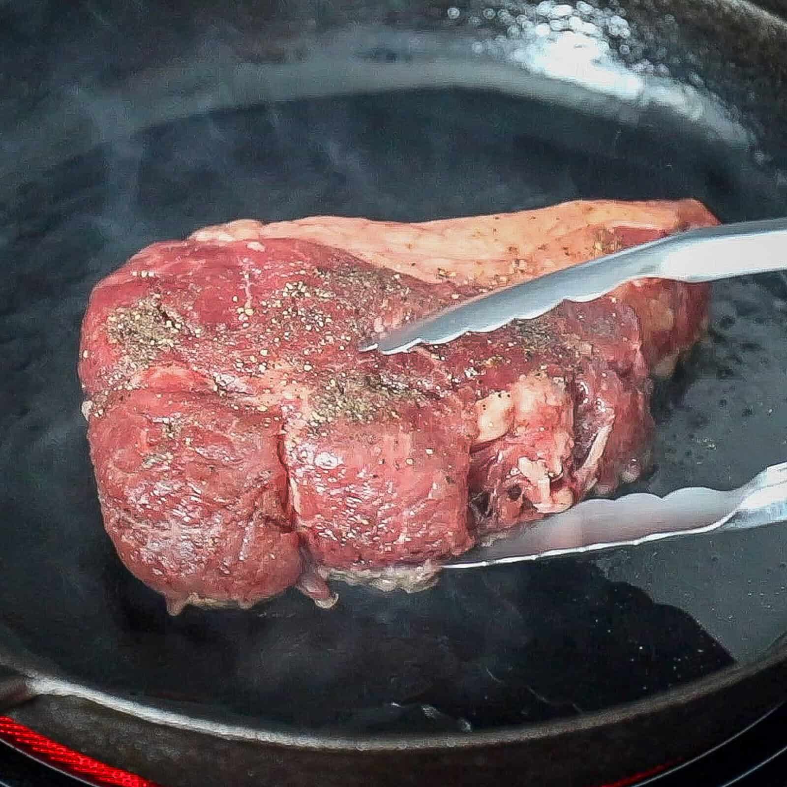 Searing a sirloin steak on the stovetop