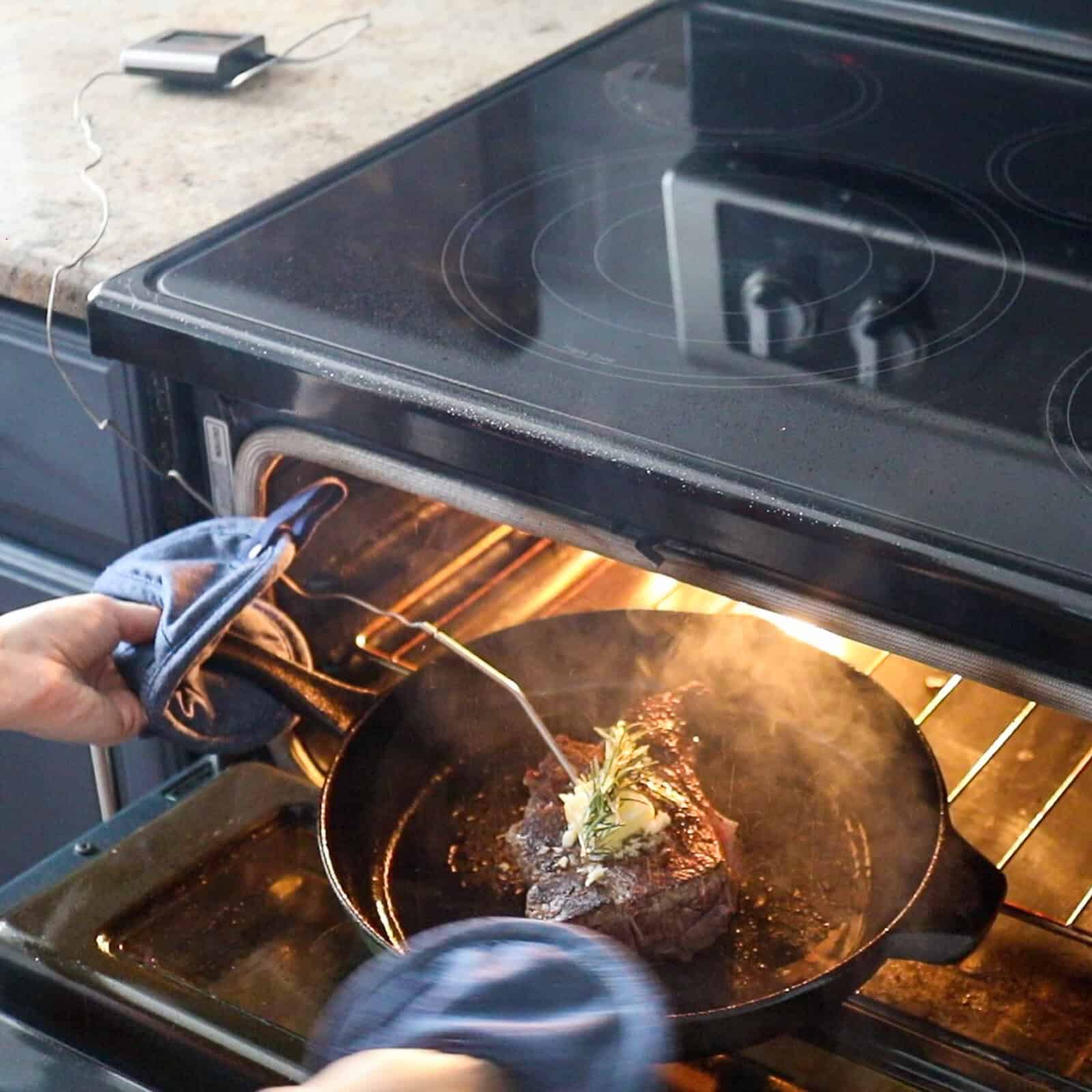 Cooking top sirloin steak in the oven with butter and rosemary