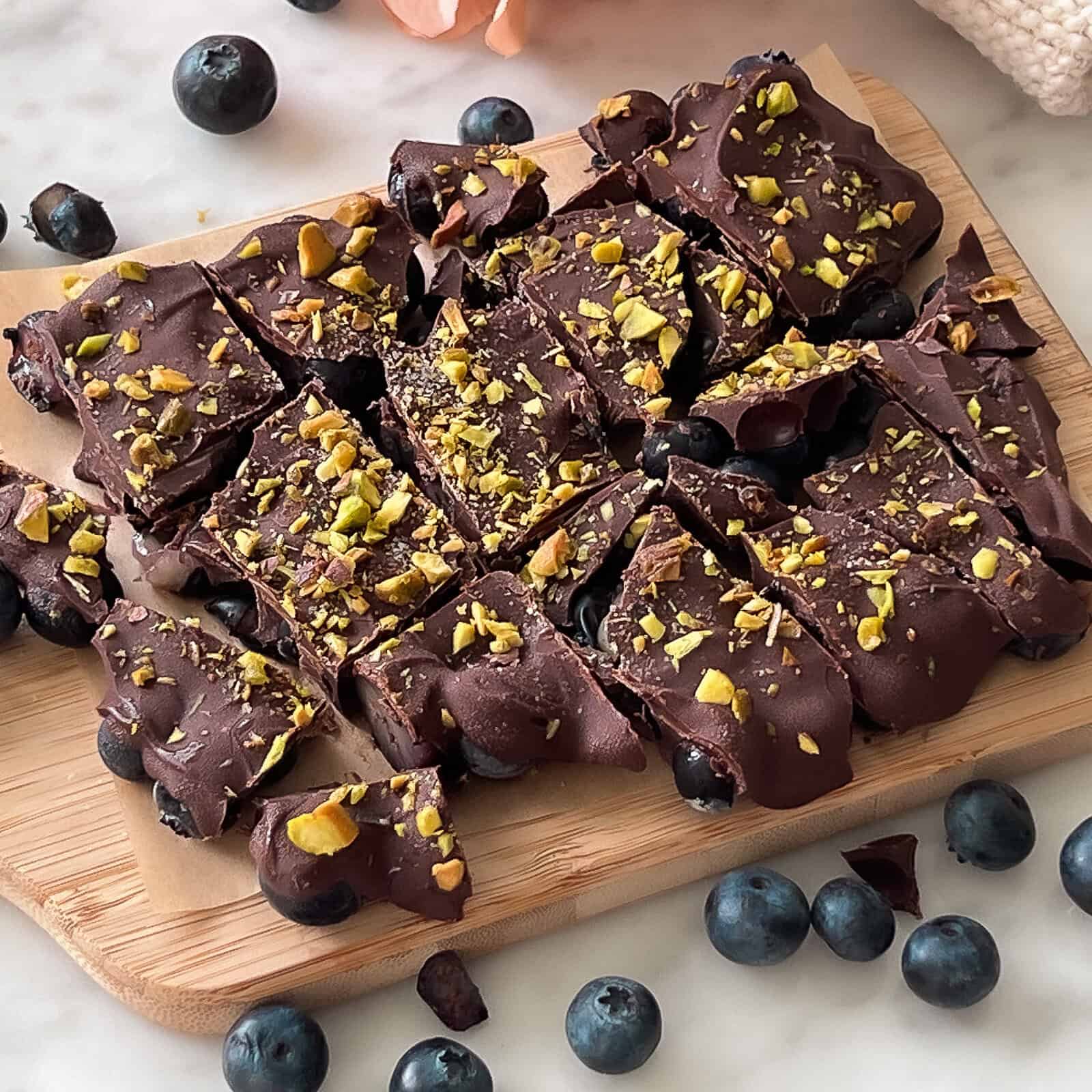 Sliced frozen blueberry chocolate bark for snacking