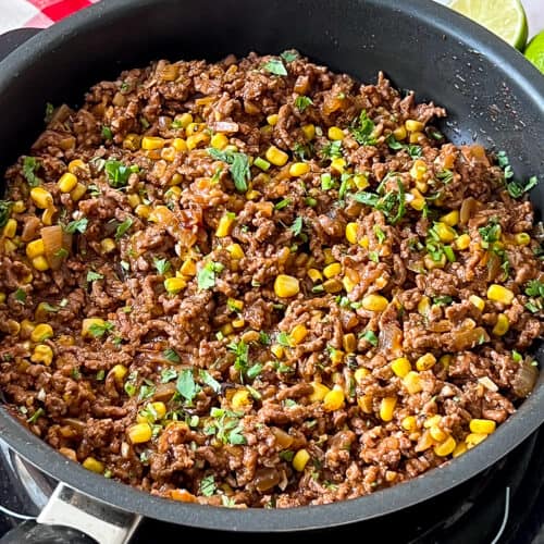 Ground beef and corn taco skillet cooking on the stove