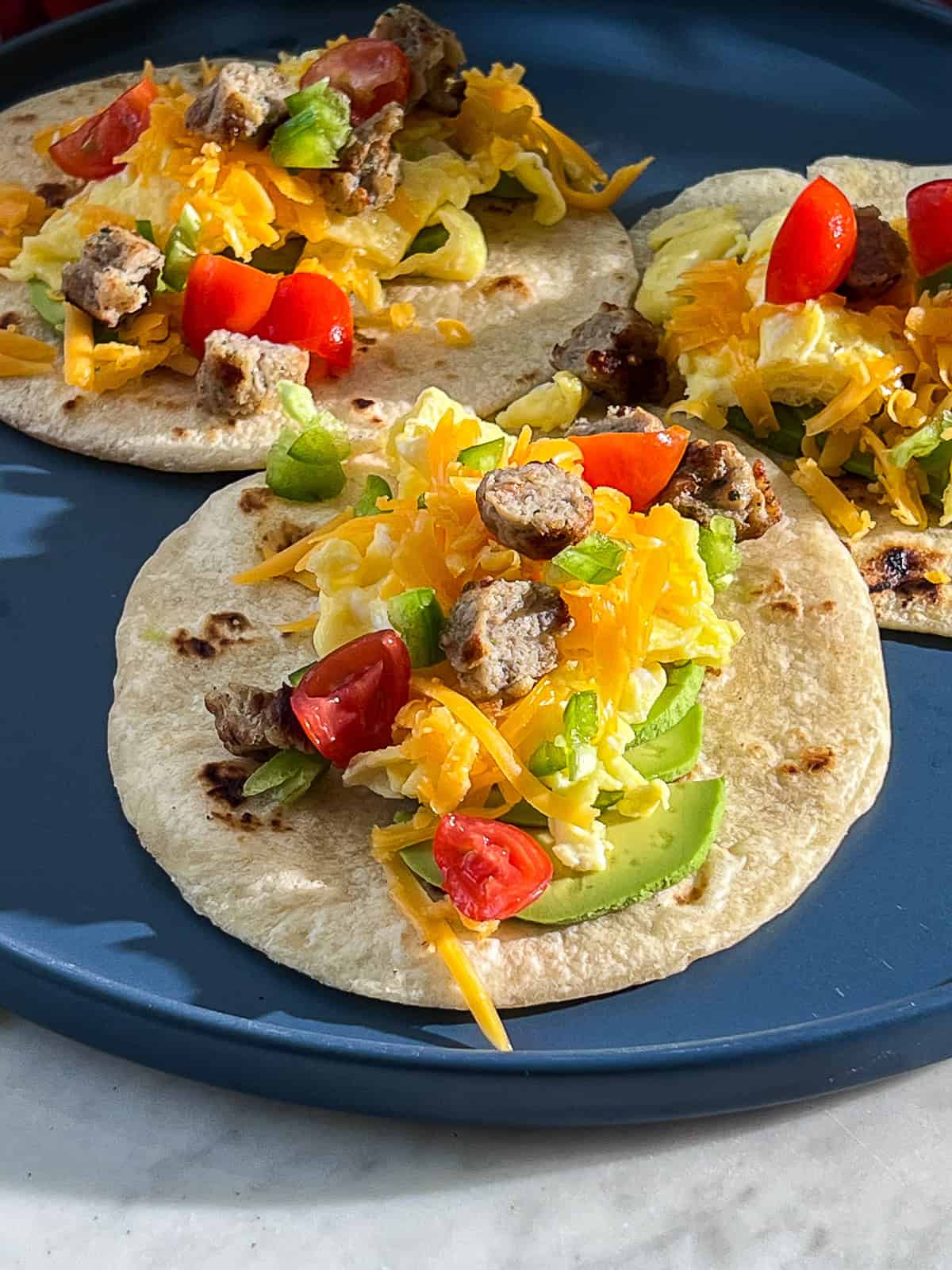 breakfast tacos filled and wrapped in homemade butter tortillas