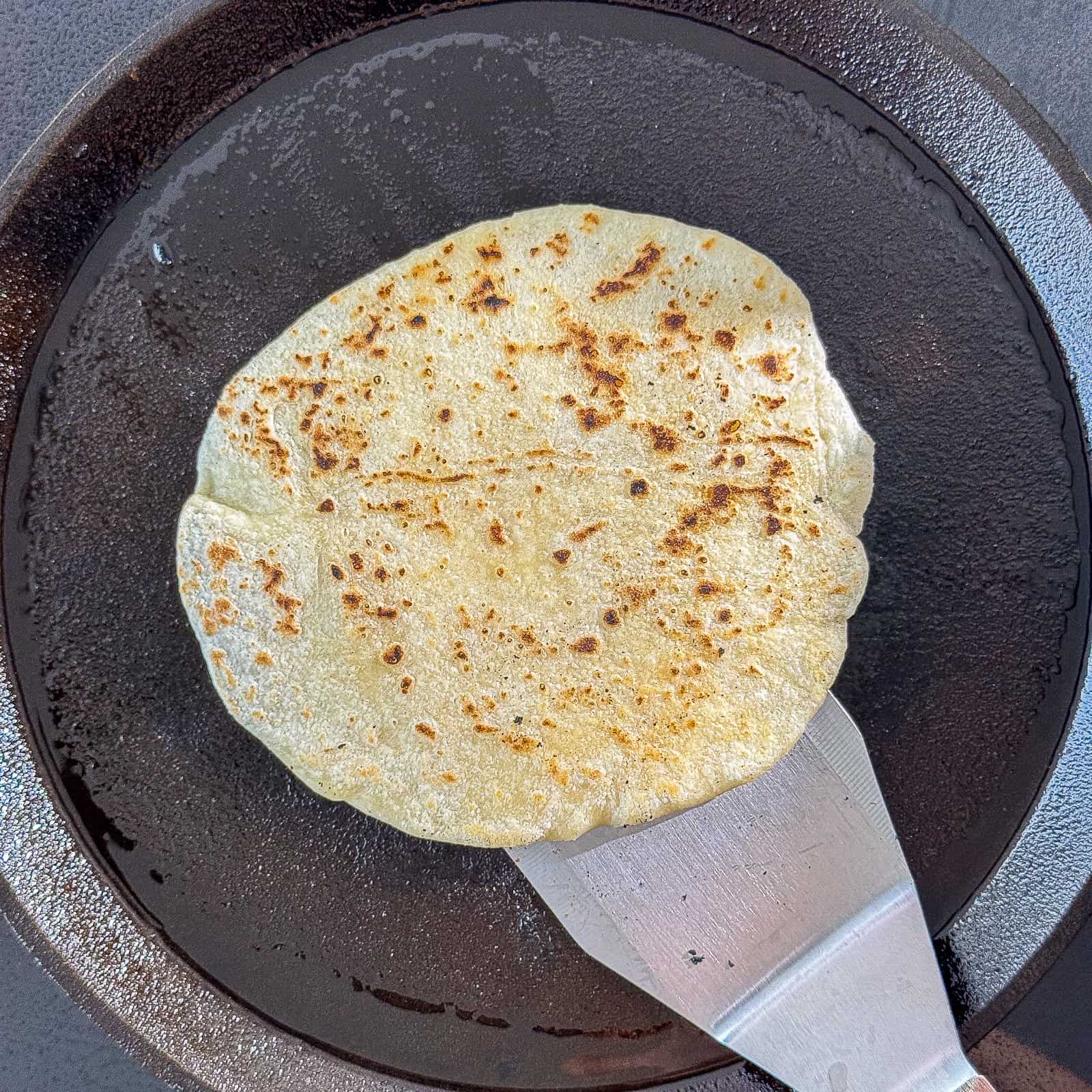 hot cast iron skillet preheated for cooking tortillas