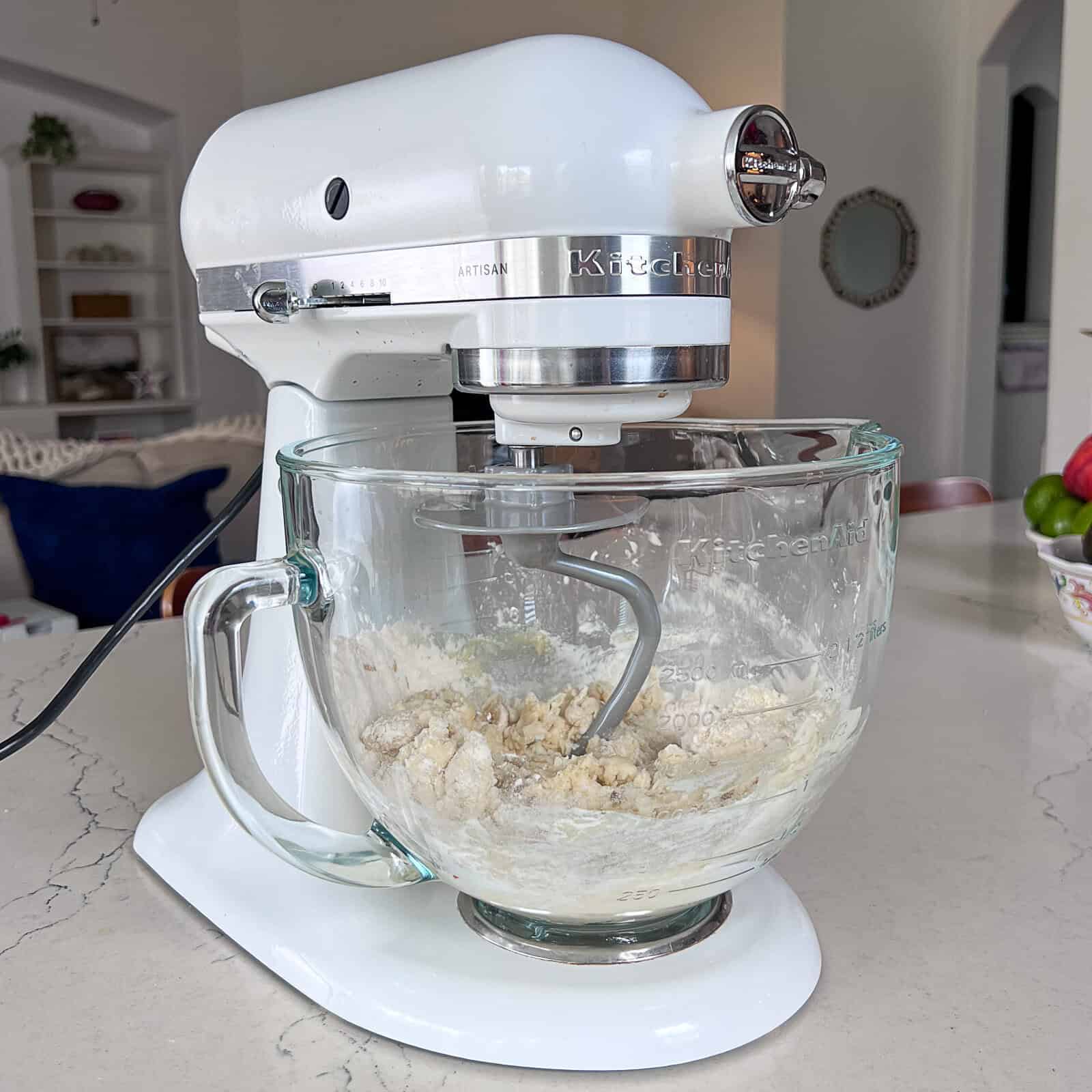 kneading butter tortilla dough by hand on a counter with option to use a stand mixer