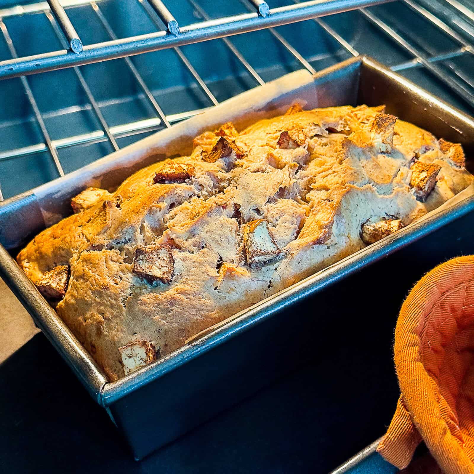 baked cinnamon apple banana bread golden brown in the oven