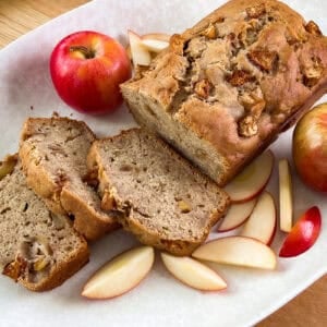 Slice of cinnamon apple banana bread on a plate