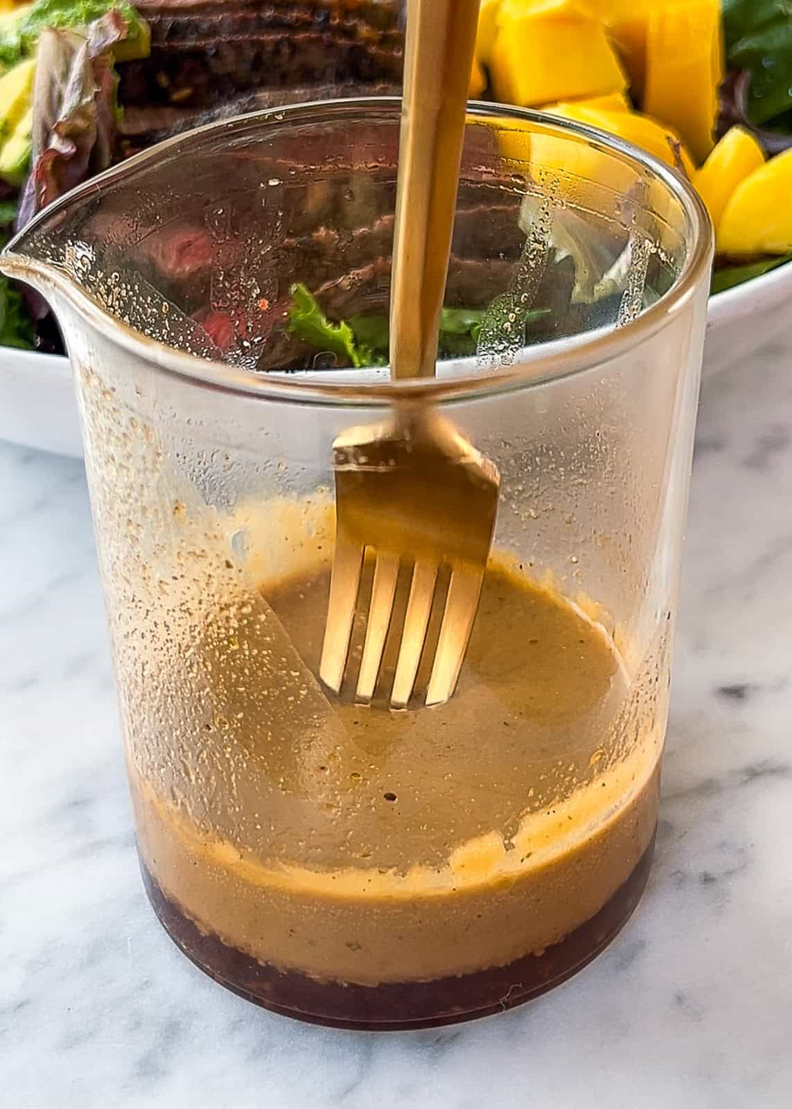 Steak and mango salad with avocado chunks and mozzarella cheese