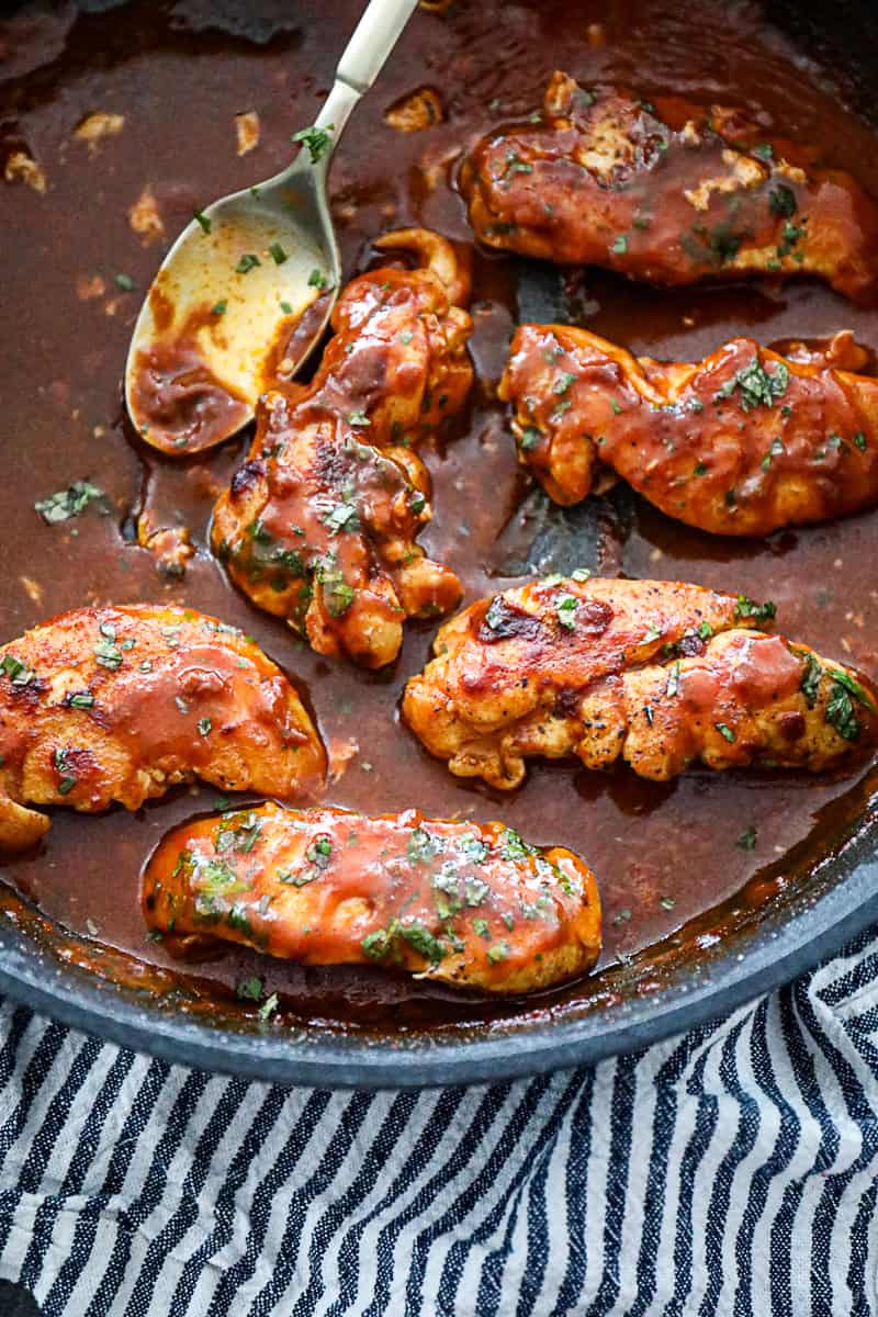 Pan with Simmered Chicken Breast Tenderloin With Enchilada Sauce and cilantro