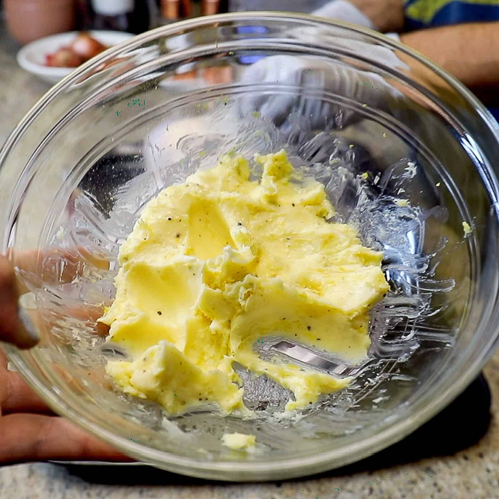 Making compound butter for spatchcock turkey in the smoker