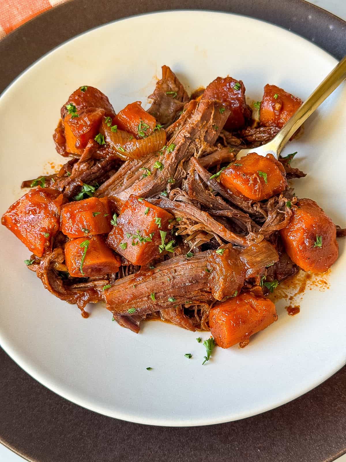 Guinness pot roast beef dinner plated with vegetables