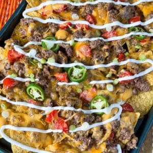 Finished viral sheet pan nachos with sliding cheese