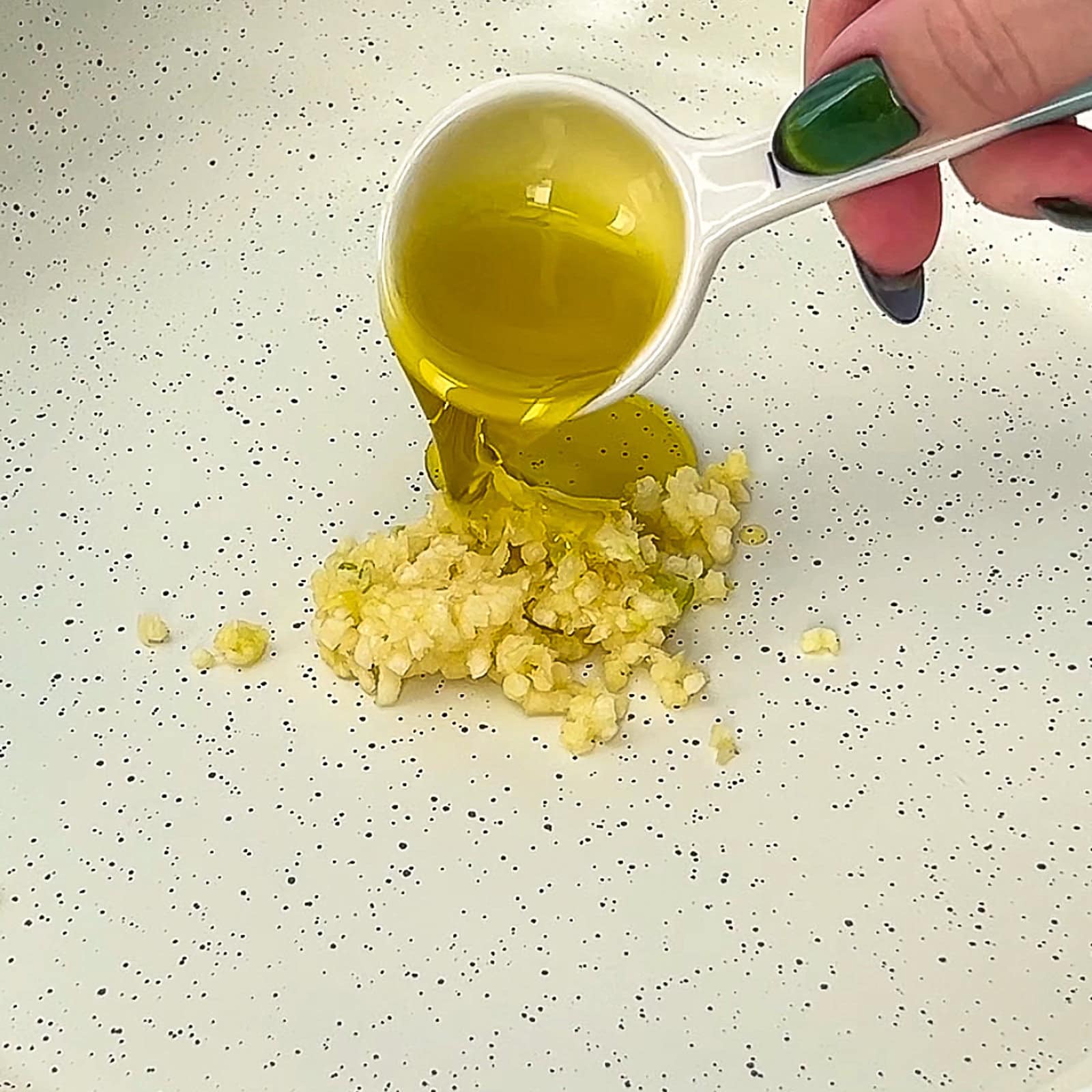 Garlic cooking in a pan until fragrant