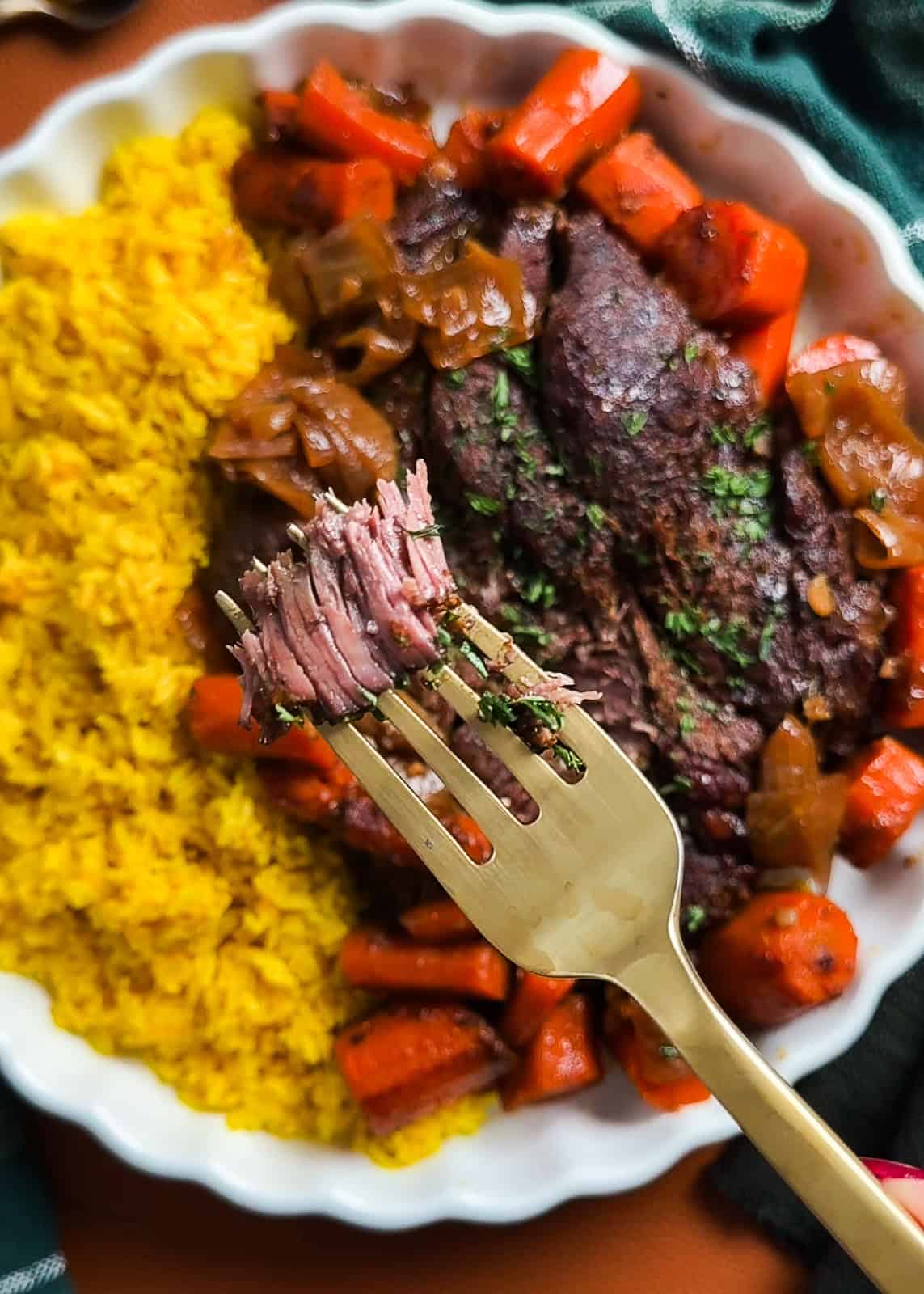 Close-up of tender shredded chuck roast from pot roast in enchilada sauce