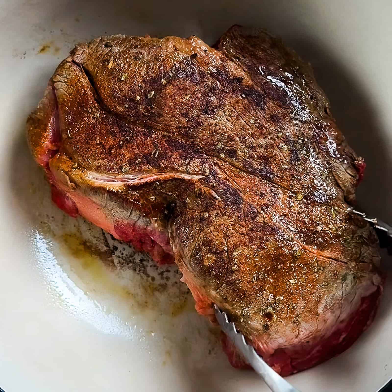 Searing pot roast in a Dutch oven on the stovetop