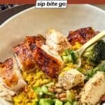 A colorful weeknight chicken bowl served with golden turmeric rice and fresh vegetables