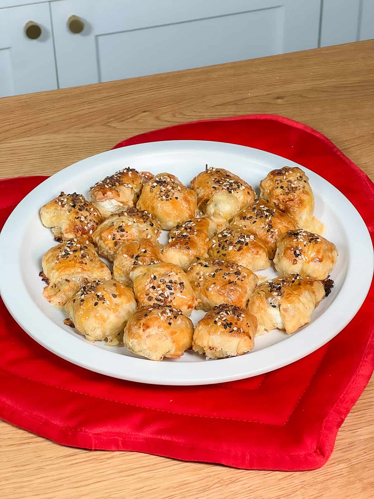 Plate of golden puff pastry brie and fig bites