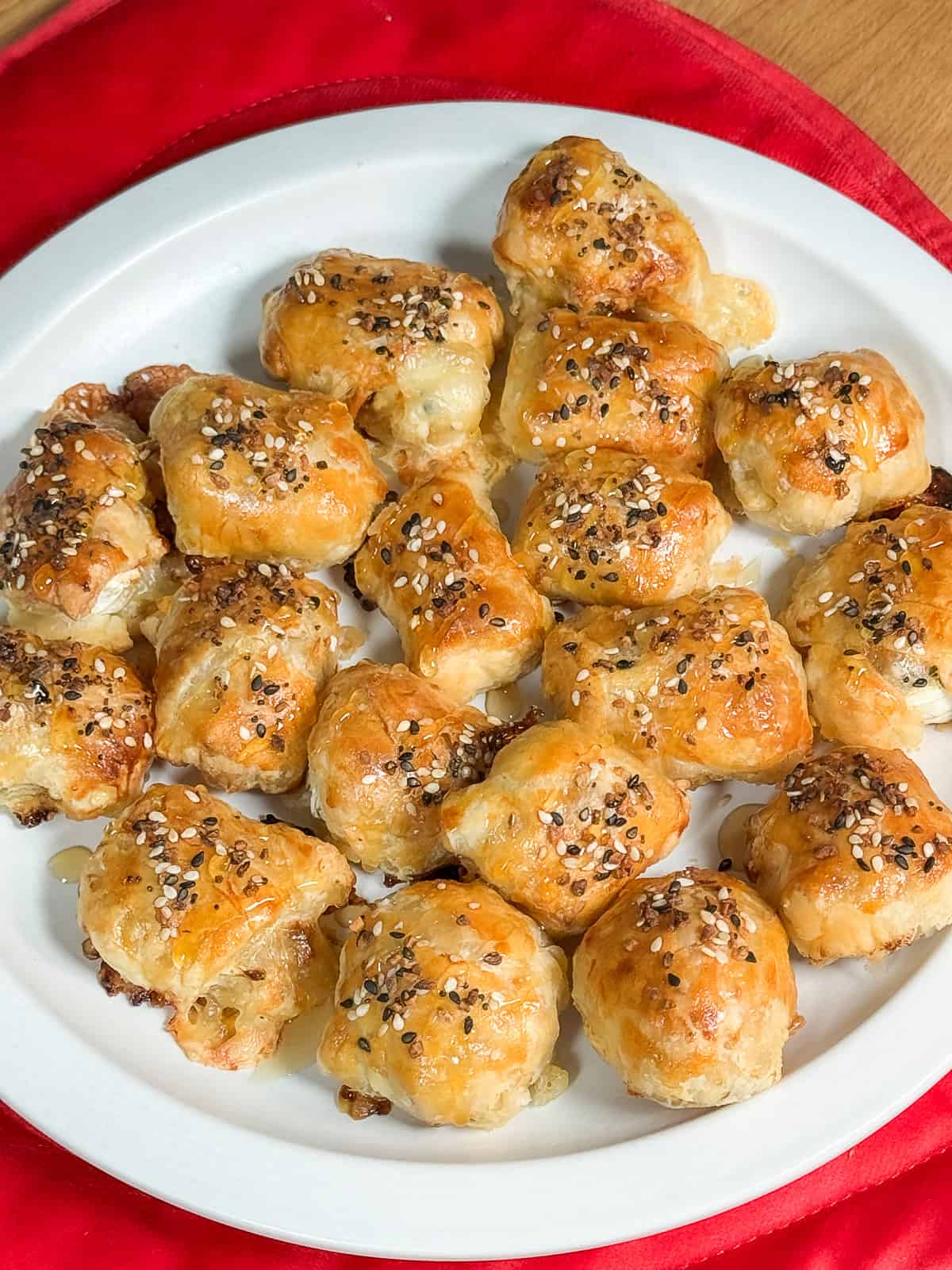 Platter of baked puff pastry brie and fig bites served warm