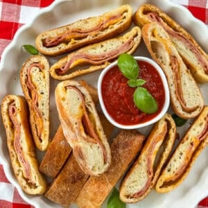 Whole stromboli on a serving platter ready to slice