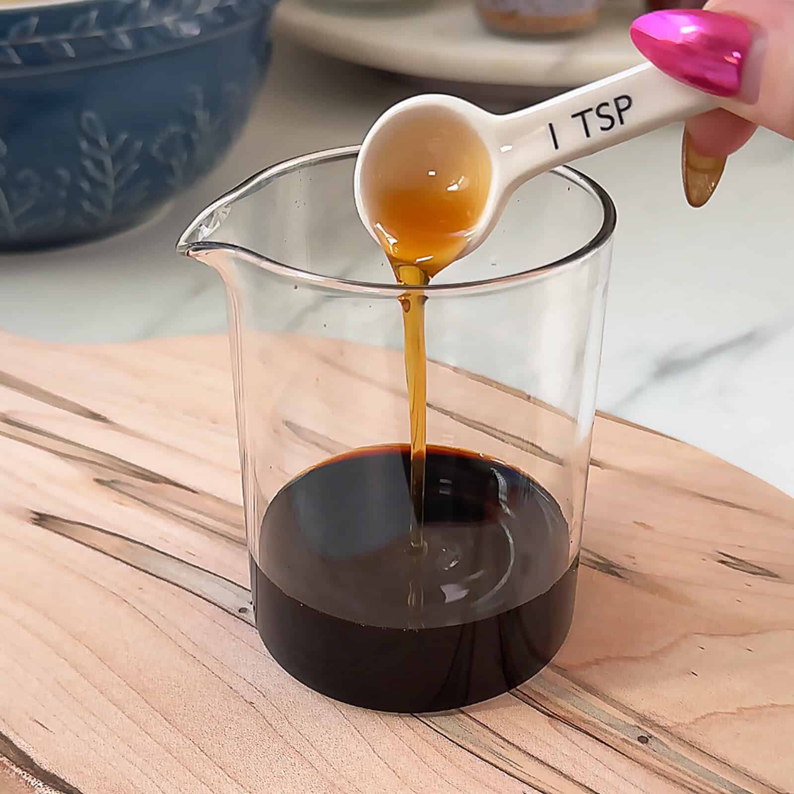 Soy sauce, hoisin, and sesame oil mixed in bowl