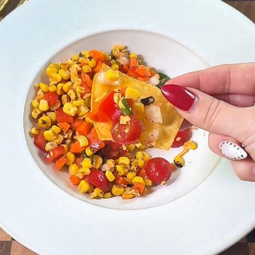 Finished bowl of Make-Ahead Corn Salsa Dip ready to serve