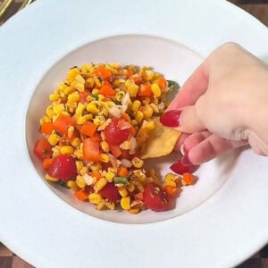 Serving Corn Salsa Dip with tortilla chips on the side