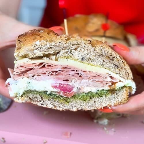 Italian mortadella sandwich with pesto and burrata stracciatella close up