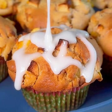 Apple peach muffins topped with lemon icing