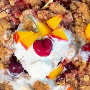 easy cherry peach crisp dessert with vanilla ice cream and fruit topping